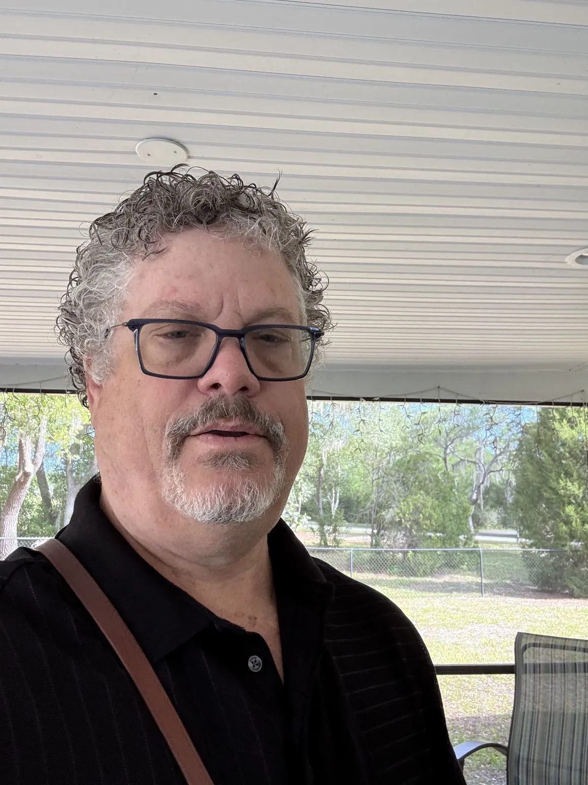 A relaxed portrait of David outdoors.