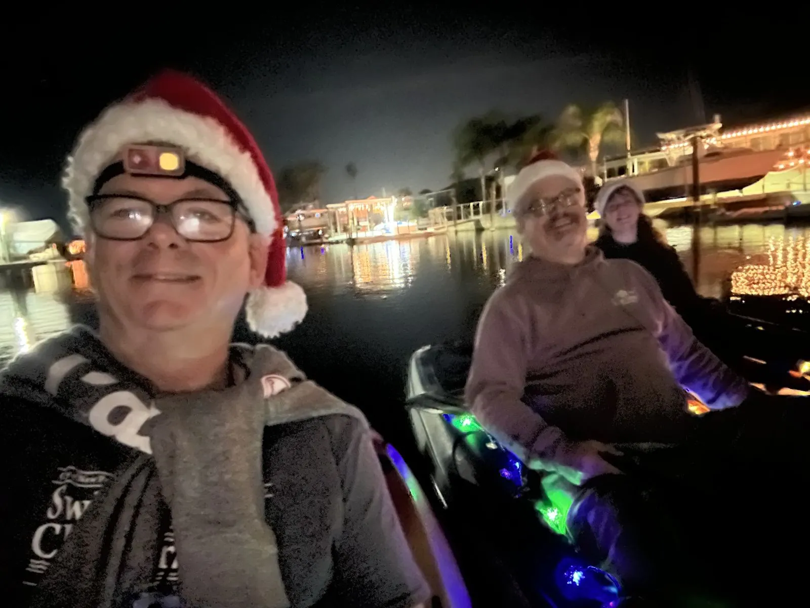 David and family on a festive night boat ride.